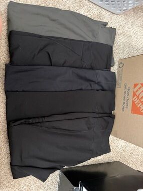 Stack of Black and Olive Pants
